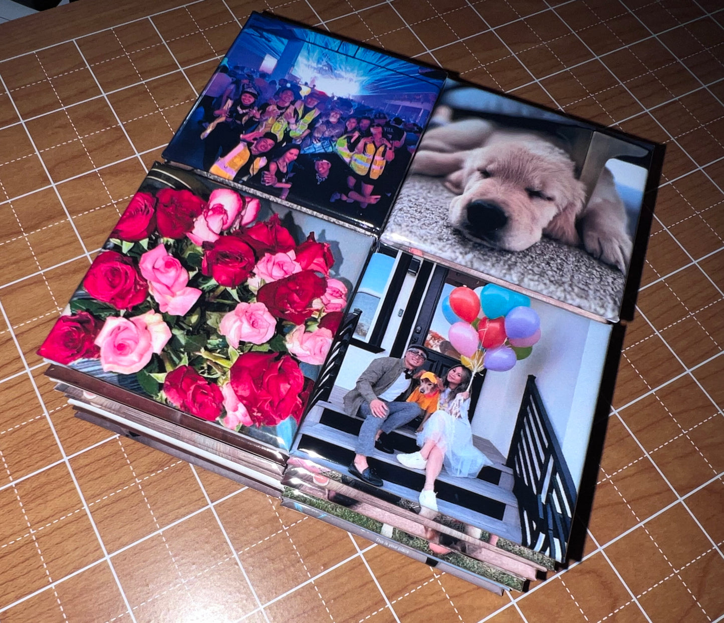 Stack of photo magnets with various images on a tiled surface